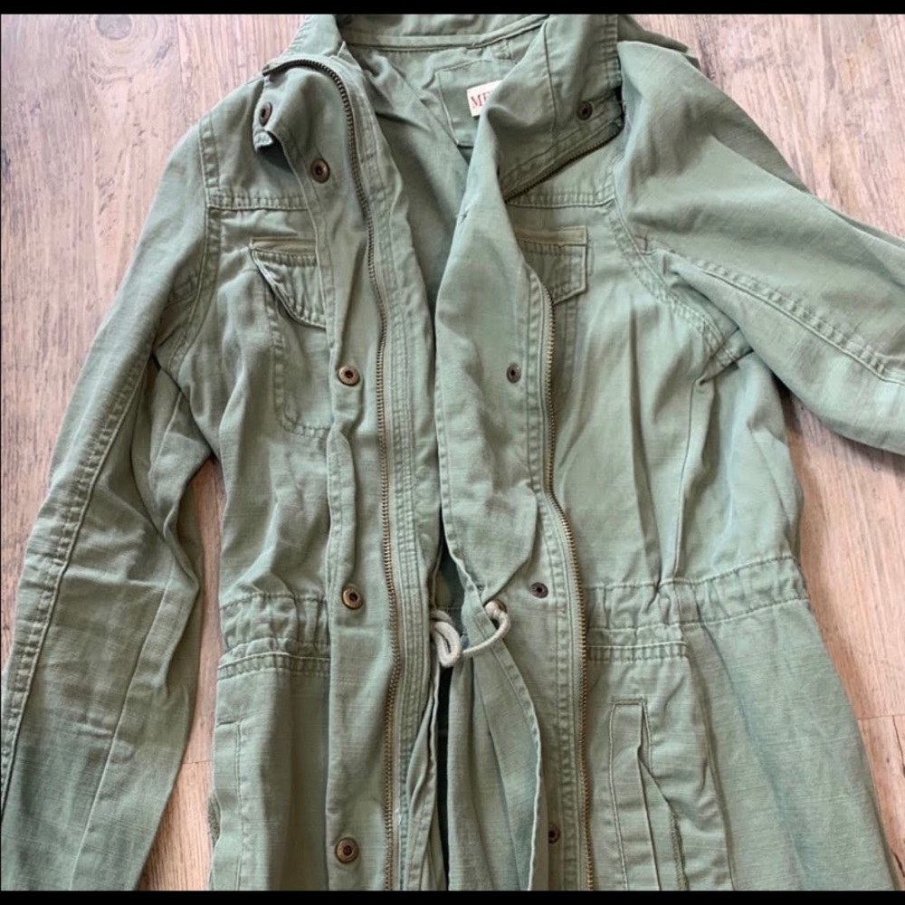 cute green jacket/ buttons and zips.